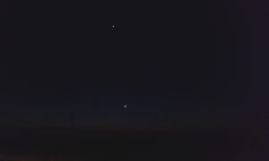 Moon about to set low in the sky over Kgalakgadi Transfrontier Park from the road to Tsabong.